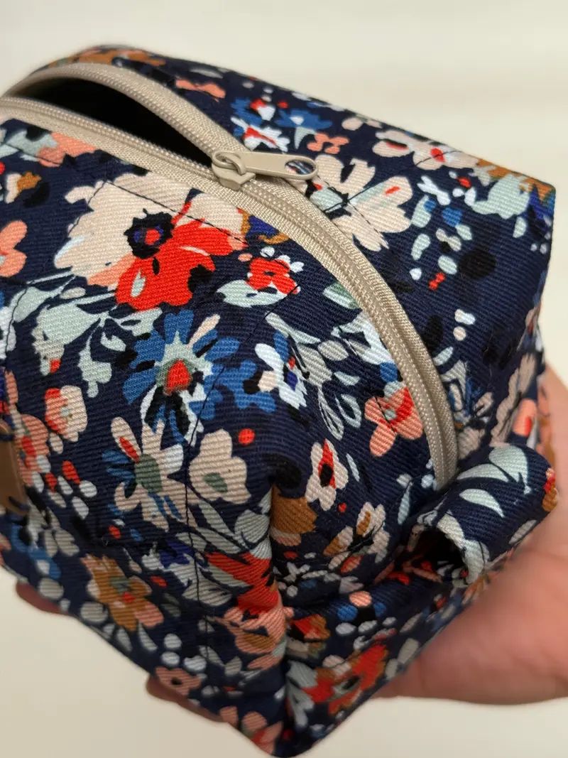 A folded TeraVida pouch and scrunchie